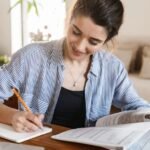 A modern, clean, and professional illustration of a student studying at a desk,